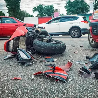 A striking red motorcycle stands out against the pavement, highlighting its sporty features and polished finish.