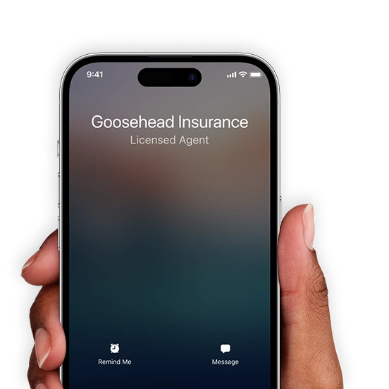 A hand holding a smartphone with an incoming call and caller ID reading Gooshead Insurance