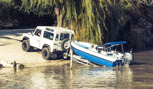 Jeep putting boat into the water
