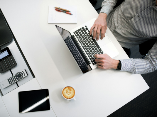 man working with coffee on the table