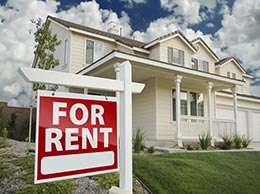 home with for rent sign in yard