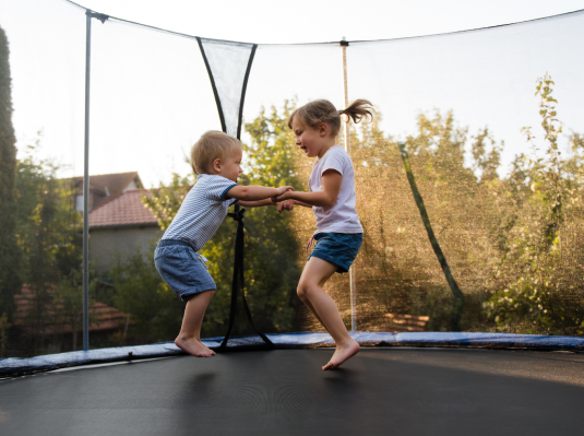 kids jumping on trampoline